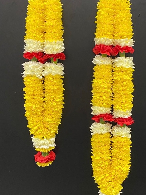 Vibrant yellow and white marigold hanging garlands